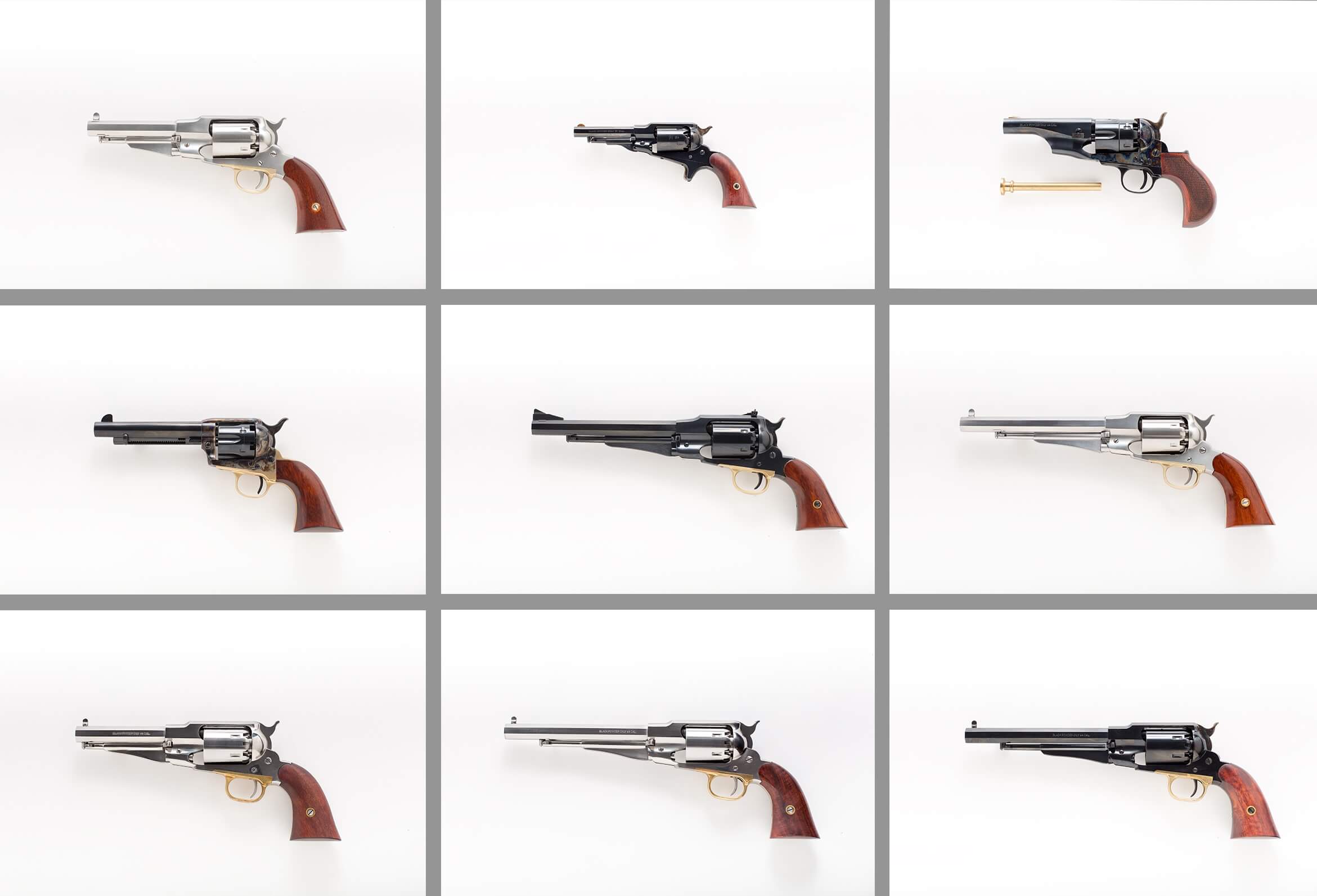 Kolekcja rewolwerów czarnoprochowych ułożona na białym tle